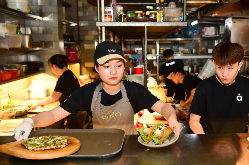The staff is preparing food at Anan Saigon Restaurant