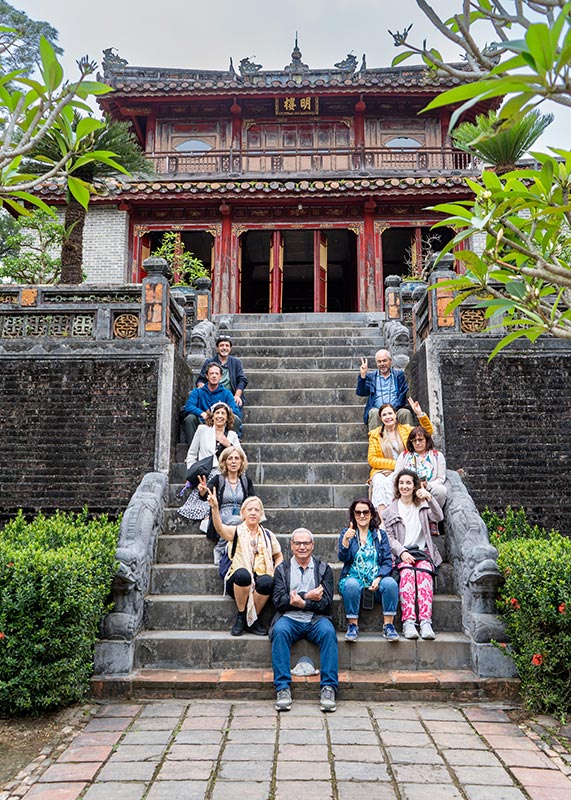 Travelers visiting a historic temple on a Vietnam tour package